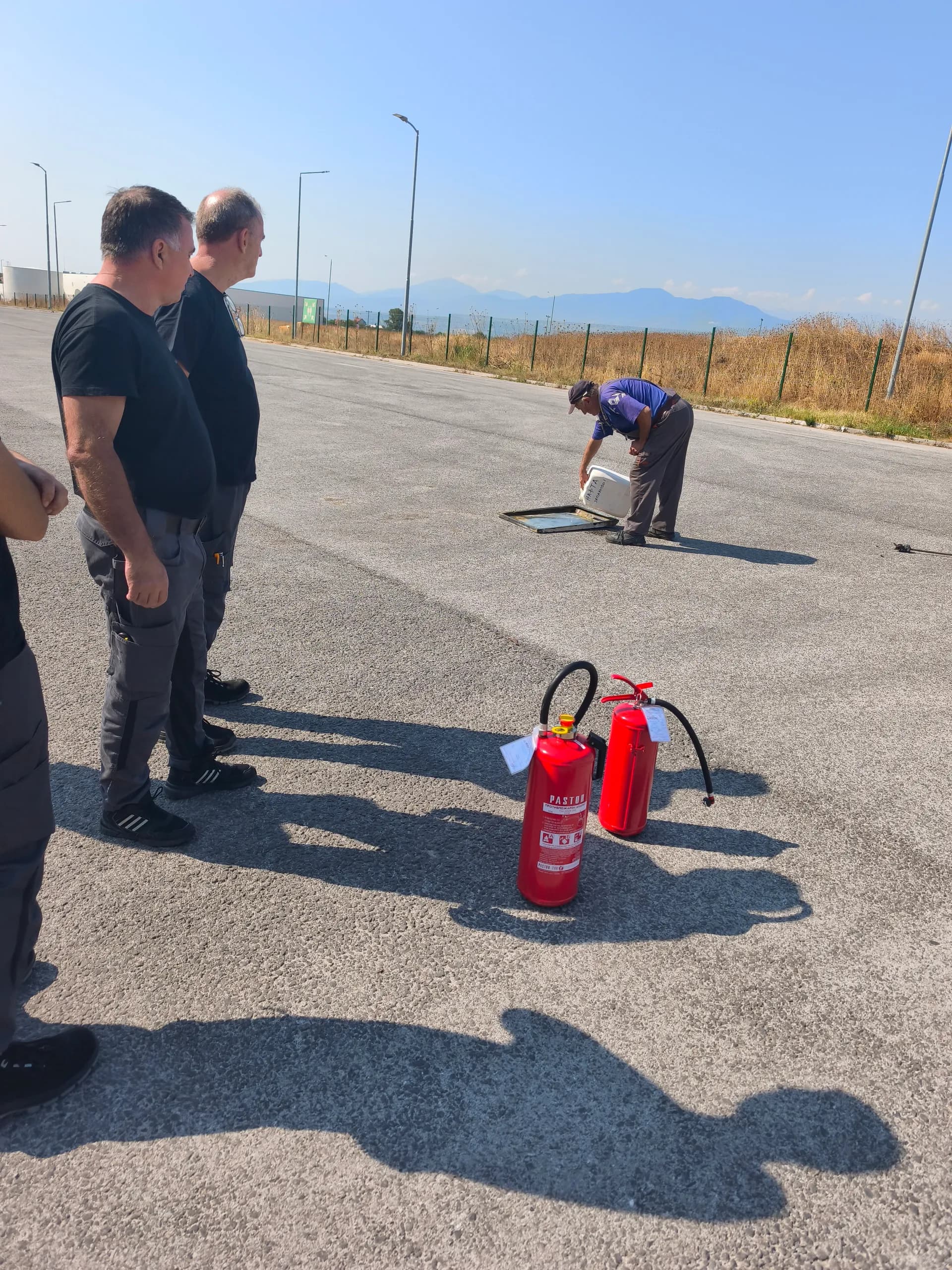 Preparing extinguishers before the practical part of fire safety training